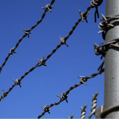 Barbed Wire On Top Of The Chain Link Fence - Image 2